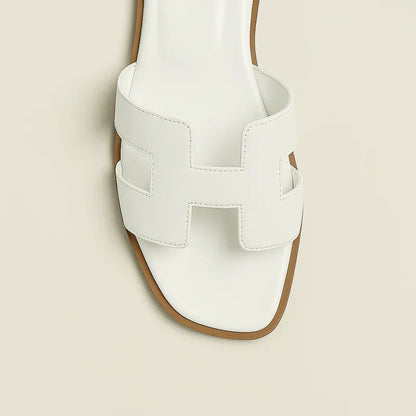 Ivyris | Elegante flade sandaler med udskåret design