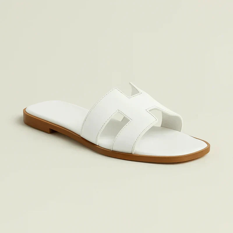 Ivyris | Elegante flade sandaler med udskåret design