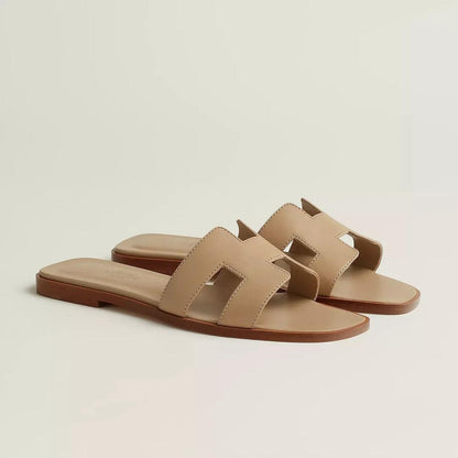 Ivyris | Elegante flade sandaler med udskåret design