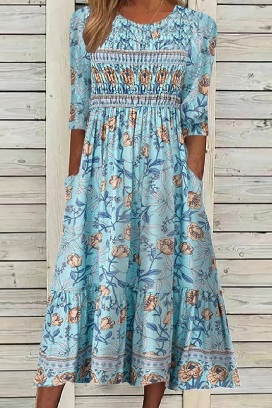Yvonne – Blomstret midikjole med smockdetaljer