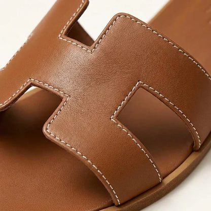 Ivyris | Elegante flade sandaler med udskåret design