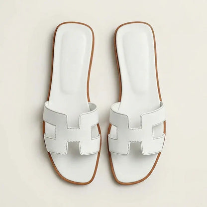 Ivyris | Elegante flade sandaler med udskåret design